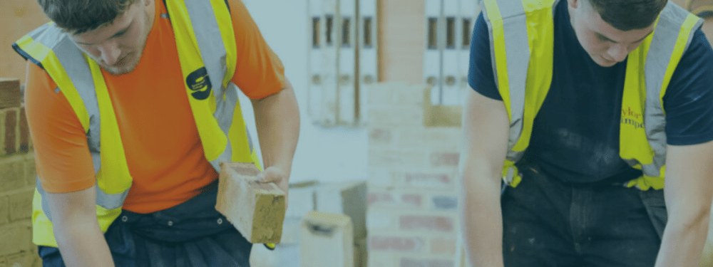 Young people brick laying