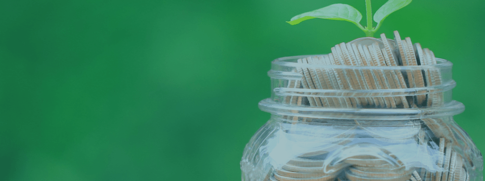 Stack of coins and a jar of coins.