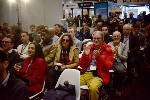 Julian Williams (central - Orange jacket), Highly Commended for Retrofit Coordinator of the Year, clapping in the audience.